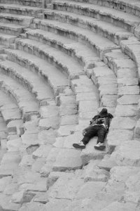 A tourist rests in a Roman amphitheatre in Amman, Jordan.